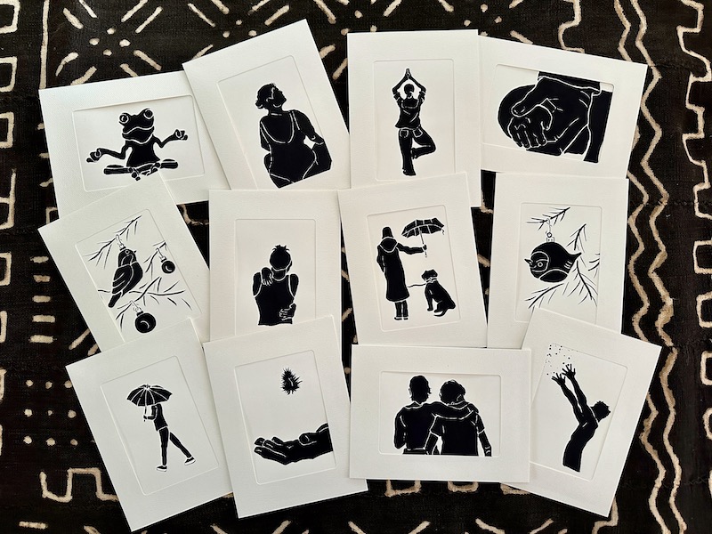 Twelve ink silhouettes in 5 x 7 inch mats